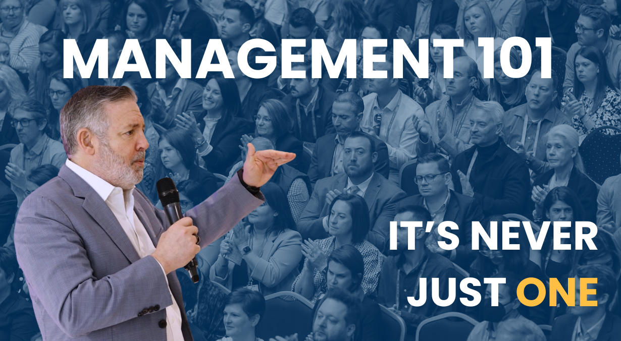 Phil Shawe speaking in front of a group of people. On screen text reads "it's never just one"